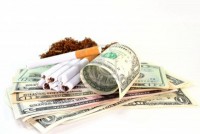 /album/combate-ao-tabagismo/a8809194-cigarettes-money-and-tobacco-on-white-background-jpg/